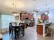 Modern kitchen with stainless steel appliances, granite countertops, and dark wood cabinetry at 169 Verde Way, Debary, FL 32713