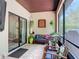 Screened-in lanai featuring wood furniture, plants, and wood ceiling at 169 Verde Way, Debary, FL 32713