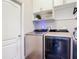 Laundry room featuring new washer and dryer, built-in cabinets, and ample storage space at 169 Verde Way, Debary, FL 32713