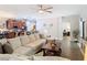 Large living room with sofa and view of kitchen and dining room at 169 Verde Way, Debary, FL 32713