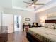 Spacious main bedroom with a tray ceiling, ceiling fan, and ensuite bathroom access at 169 Verde Way, Debary, FL 32713