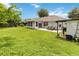 A spacious backyard with patio, shed and mature landscaping at 176 Hidden View Dr, Groveland, FL 34736