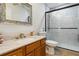 Modern bathroom featuring a single sink vanity, tiled shower, and updated fixtures at 176 Hidden View Dr, Groveland, FL 34736