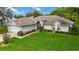 Well-manicured lawn and landscaping accent this single story home's inviting curb appeal at 176 Hidden View Dr, Groveland, FL 34736