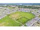 Primary-planned community featuring modern homes, parks, and walking trails from above at 1787 White Feather Loop, Oakland, FL 34787