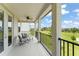 Covered balcony featuring an outdoor ceiling fan and outdoor seating with community view at 1787 White Feather Loop, Oakland, FL 34787
