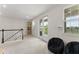 Spacious bonus room with a balcony, carpet flooring, and large windows for natural light at 1787 White Feather Loop, Oakland, FL 34787