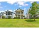 Two-story home with manicured lawn and second story balcony at 1787 White Feather Loop, Oakland, FL 34787