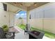 Charming outdoor patio with Adirondack chairs surrounding a modern fire pit and string lights at 1787 White Feather Loop, Oakland, FL 34787