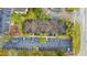 Aerial shot showing building with parking and play area. Tree lined street and sidewalks at 1910 Summer Club Dr # 108, Oviedo, FL 32765