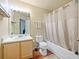 Bathroom with neutral tones, shower/tub combo, and vanity at 1910 Summer Club Dr # 108, Oviedo, FL 32765