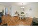 Well-lit dining area with stylish décor, flowing into an open-concept living space at 1910 Summer Club Dr # 108, Oviedo, FL 32765