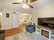 Cozy living room with fireplace, modern furnishings, and a seamless flow into the dining area at 1910 Summer Club Dr # 108, Oviedo, FL 32765