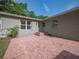Backyard with a brick patio, perfect for outdoor entertaining at 2100 Forest Cir, Orlando, FL 32803