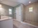 Bathroom featuring tiled shower, granite vanity, and modern fixtures at 2100 Forest Cir, Orlando, FL 32803