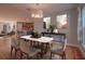 Spacious dining area with hardwood floors, open to the kitchen, perfect for entertaining guests at 2100 Forest Cir, Orlando, FL 32803