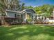 Charming home with a well-manicured lawn and colorful landscaping at 2100 Forest Cir, Orlando, FL 32803
