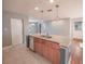 Open kitchen featuring an island with granite countertops and stainless steel appliances at 2100 Forest Cir, Orlando, FL 32803