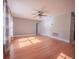 Spacious living room with hardwood floors, ceiling fan, and natural light at 2100 Forest Cir, Orlando, FL 32803