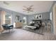 Tranquil main bedroom showcasing neutral tones, dual windows, and soft carpet at 2100 Forest Cir, Orlando, FL 32803
