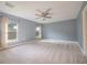 Bright and airy main bedroom with soft carpet, dual windows, and ample space at 2100 Forest Cir, Orlando, FL 32803