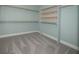 Walk-in closet with built-in shelving and rod for organized storage at 2100 Forest Cir, Orlando, FL 32803