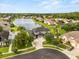 Aerial view of a landscaped property by the water at 218 Pebblerock Ct, Orlando, FL 32828