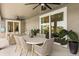 This patio area is equipped with comfortable seating and open access via sliding glass doors at 218 Pebblerock Ct, Orlando, FL 32828