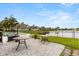 This backyard is complete with a lovely patio area that includes lounge chairs and scenic views at 218 Pebblerock Ct, Orlando, FL 32828