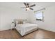 Comfortable bedroom featuring hardwood floors, ceiling fan, and window at 218 Pebblerock Ct, Orlando, FL 32828
