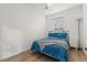 Simple bedroom featuring a queen bed, hardwood floors, and natural light at 218 Pebblerock Ct, Orlando, FL 32828