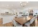 Open concept dining and living room area boasts modern lighting and a spacious layout at 218 Pebblerock Ct, Orlando, FL 32828