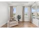 A comfortable sitting area with a cozy chair, plant and multiple windows providing natural light at 218 Pebblerock Ct, Orlando, FL 32828