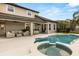 A stunning swimming pool and covered patio area offering a perfect blend of relaxation and entertainment at 218 Pebblerock Ct, Orlando, FL 32828