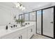Elegant bathroom featuring double sink vanity, walk-in shower, and modern fixtures at 2233 Valentine Aly, Orlando, FL 32804