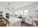 Contemporary kitchen with white cabinetry, island seating, and stainless steel appliances at 2233 Valentine Aly, Orlando, FL 32804