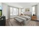 This main bedroom has an accent wall, a queen sized bed and large windows at 2233 Valentine Aly, Orlando, FL 32804