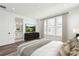 Main bedroom showcasing an ensuite bathroom, large windows and neutral decor at 2233 Valentine Aly, Orlando, FL 32804
