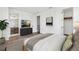 Bright main bedroom featuring ensuite bath, and large window with decorative black out curtains at 2233 Valentine Aly, Orlando, FL 32804