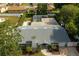 Aerial view of the property featuring a pool with screened enclosure and a large backyard at 2325 E Harding Street, Orlando, FL 32806