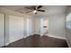 Bedroom features hardwood floors and dual closets with access to the en-suite bathroom at 2325 E Harding Street, Orlando, FL 32806