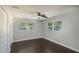 Bedroom with hardwood floors and two windows providing natural light at 2325 E Harding Street, Orlando, FL 32806