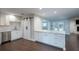 Bright kitchen with white cabinets, stainless steel appliances, and hardwood floors at 2325 E Harding Street, Orlando, FL 32806