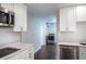 This updated kitchen boasts stainless steel appliances, white subway tile, and abundant countertop space at 2325 E Harding Street, Orlando, FL 32806