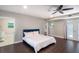 Spacious main bedroom with tile flooring in the en-suite bathroom and access to a covered patio at 2325 E Harding Street, Orlando, FL 32806