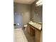 Bathroom with a vanity, a large mirror, and a toilet at 2826 Osprey Cove Pl # 103, Kissimmee, FL 34746