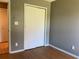 Bedroom with a standard sliding closet and hardwood floors at 2826 Osprey Cove Pl # 103, Kissimmee, FL 34746