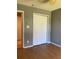 Bedroom with a standard sliding closet and hardwood floors at 2826 Osprey Cove Pl # 103, Kissimmee, FL 34746