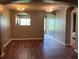 Dining room with hardwood floors and arched doorway leading to dining area with unique light fixtures at 2826 Osprey Cove Pl # 103, Kissimmee, FL 34746