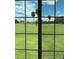 View from a window overlooking a golf course with palm trees and homes in the distance under a sunny sky at 2826 Osprey Cove Pl # 103, Kissimmee, FL 34746